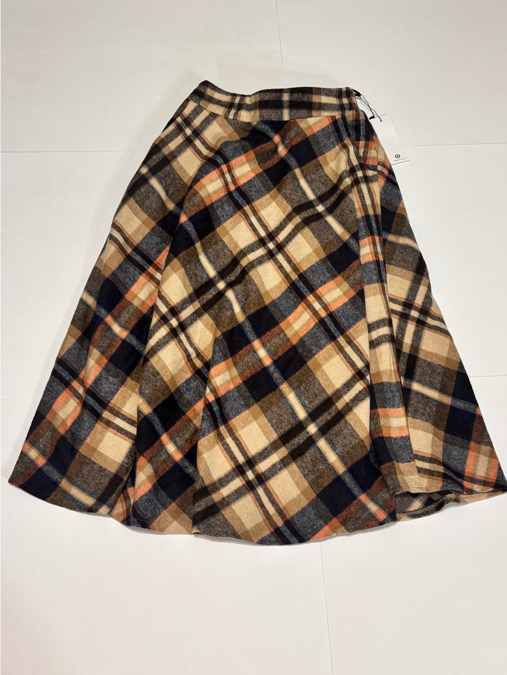 Plaid Circle Skirt in Beige and Navy with Orange Accents and Pockets.
